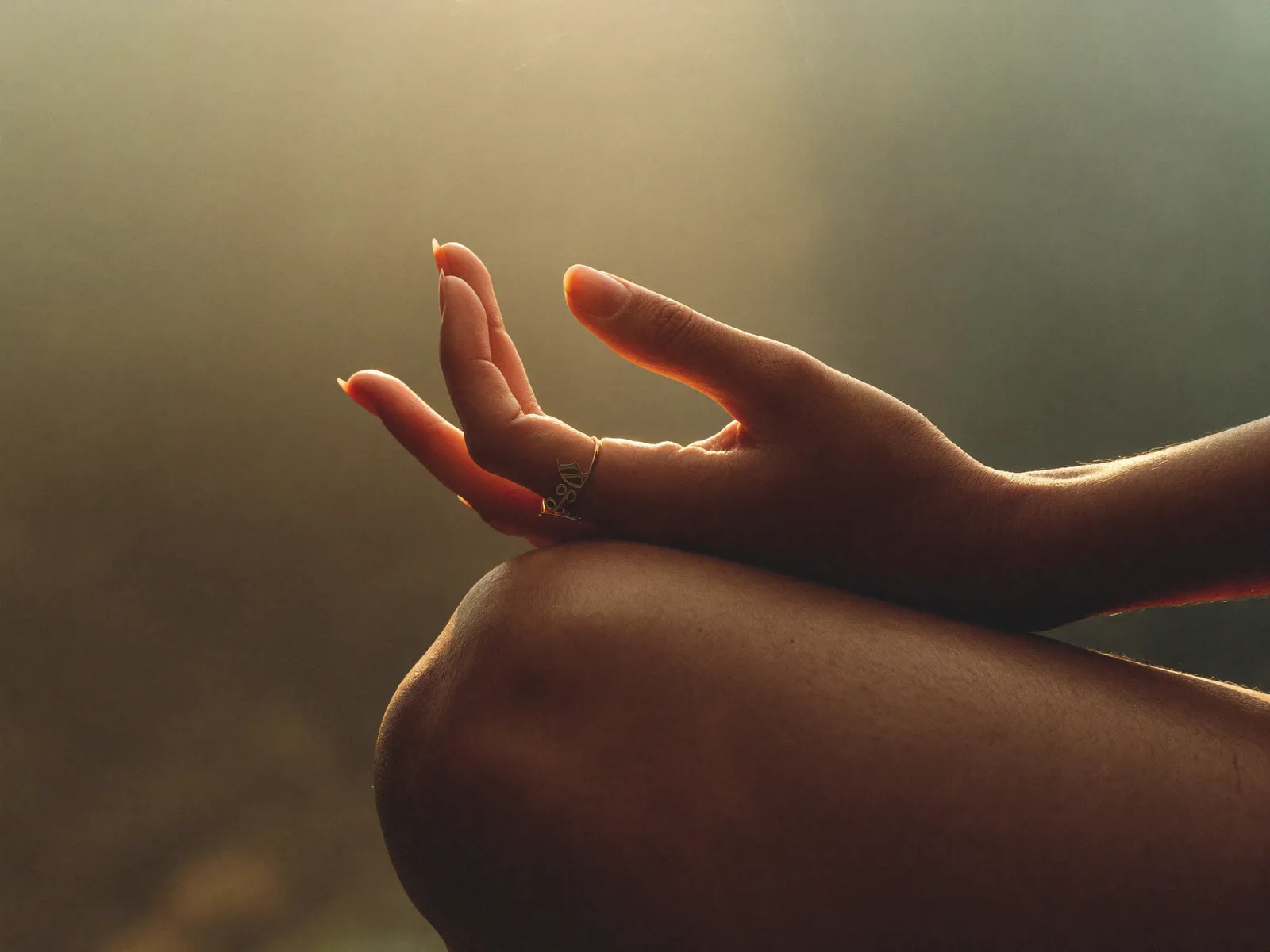 Hands resting in mudra during meditation